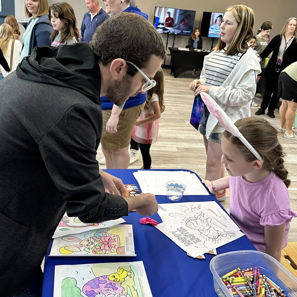 As a sponsor booth at Springfields Discovery Center, Gabe performs magic to entertain kids.