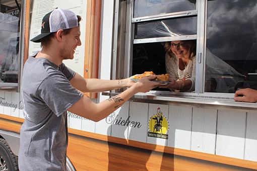 Advertising photo taken at the grand opening for Divine Kitchen food truck