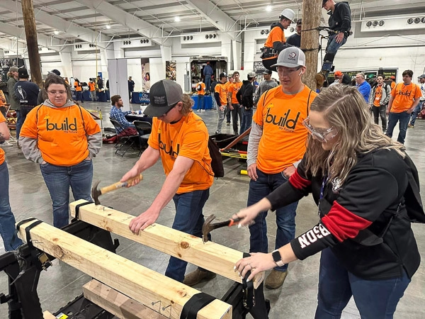 Students learning and practicing their building skills at the Springfield Contractors Association, Build U event