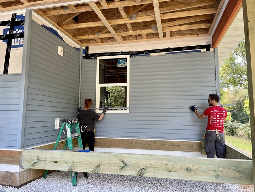 2oddballs volunteering with Habitat for Humanity and building a home